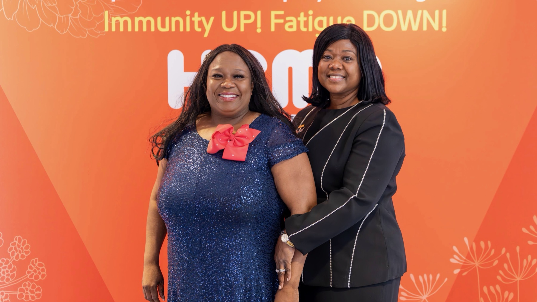 Lynnie with a community member at an Atomy gathering